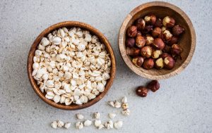 Two bowls of nuts. 